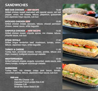 a menu for a sandwich shop is shown on a blackboard