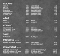 a black and white menu with prices on it