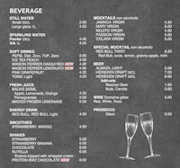 a chalkboard menu with two glasses of champagne